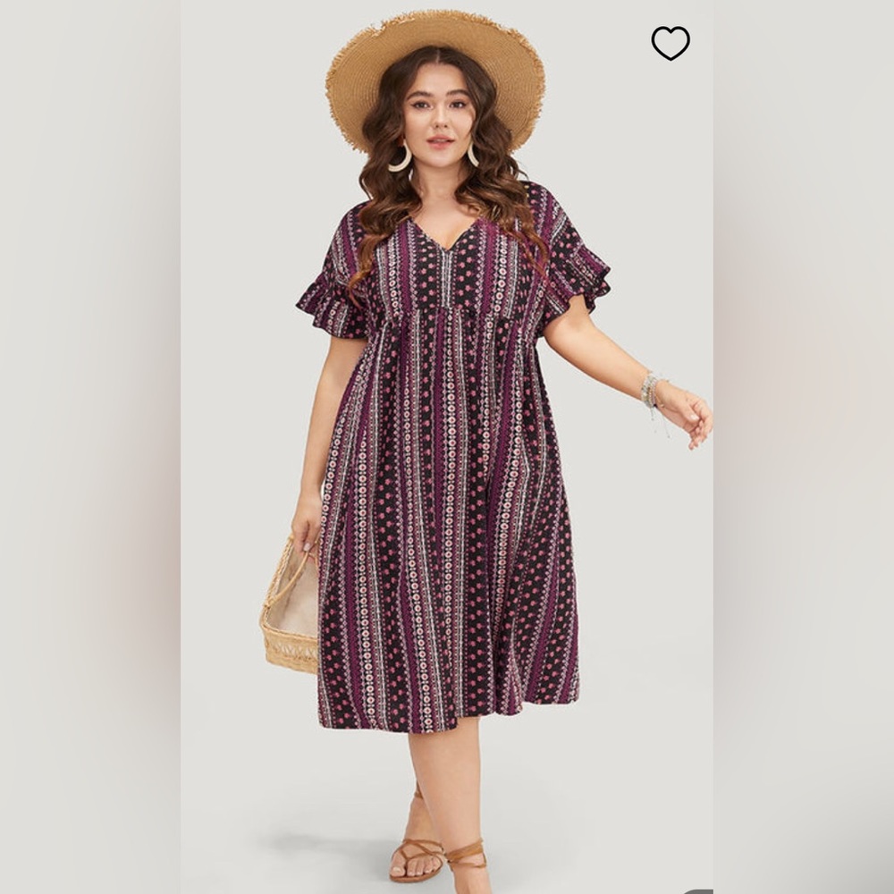 Bohemian fun! Comfortable dress w/ dolman set sleeves & ruffles to cap them off.